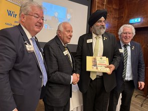 Presentation of Lions Lunch banner and book to IP Singh